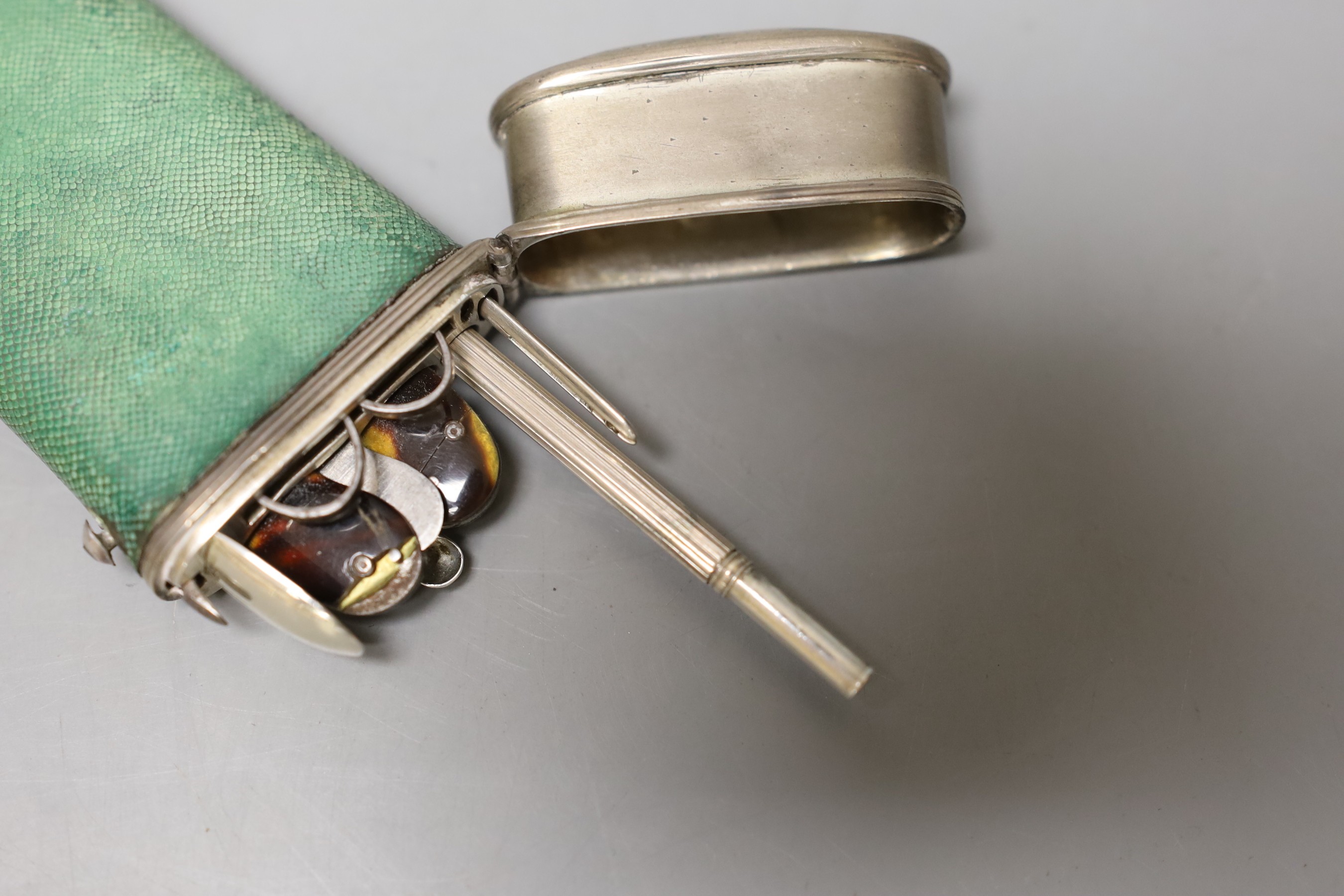 An 18th century white metal and shagreen mounted etui with steel, white metal and tortoiseshell implements, 90mm.